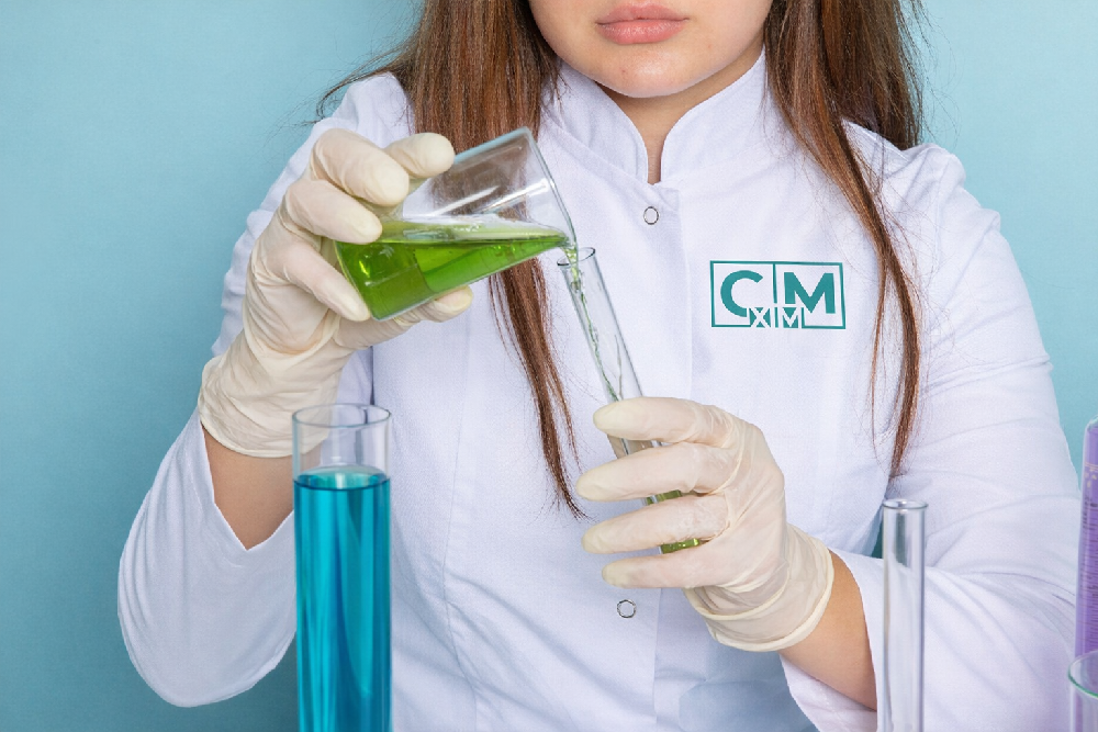 Chemist testing liquid formulas at our household chemicals manufacturing facility